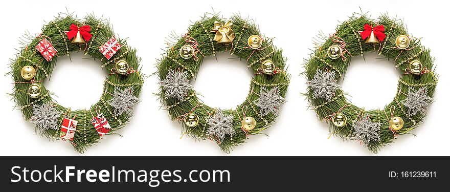 Three CHRISTMAS wreaths on a white background, copy space, close up. Three CHRISTMAS wreaths on a white background, copy space, close up