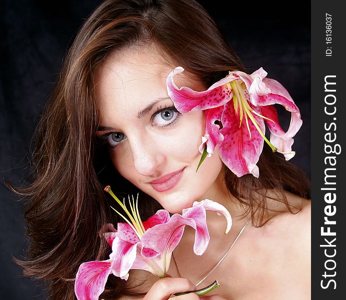 Beautiful young girl with flowers