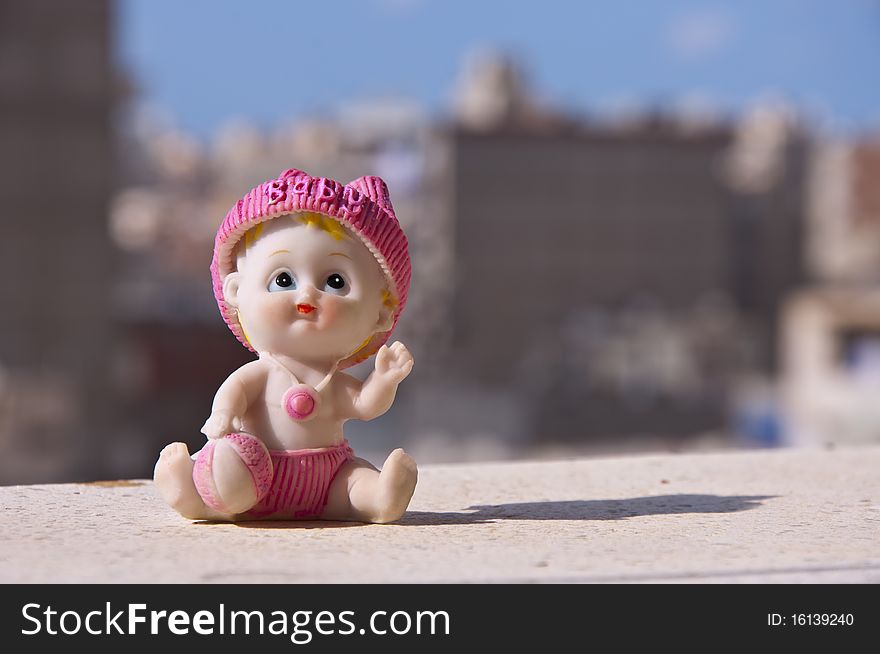 A Baby Ceramic Toy Statue