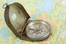 Compass On Topographical Map Stock Photo Compass On Topographical Map Stock Photo