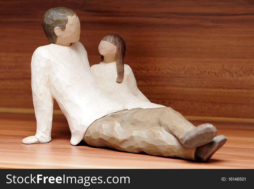 Closeup of a embracing couple in love from wood. Closeup of a embracing couple in love from wood