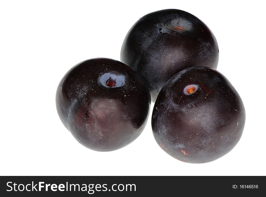 Three tasty juicy plums for freshening juice with vitamines. Three tasty juicy plums for freshening juice with vitamines