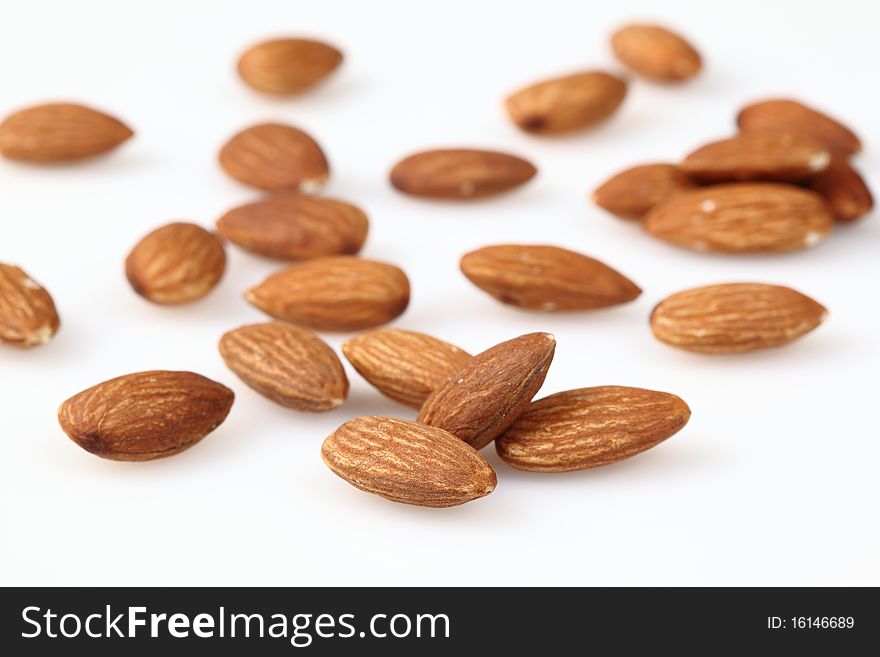Almonds Are Scattered On A Light Surface.