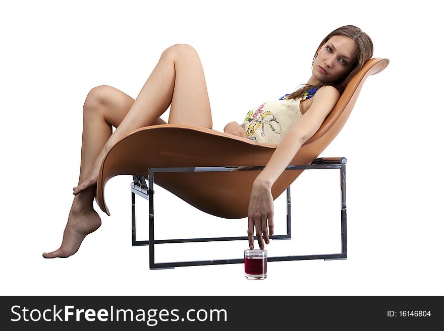 Young Female Relaxing In The Fashionable Chair Wit