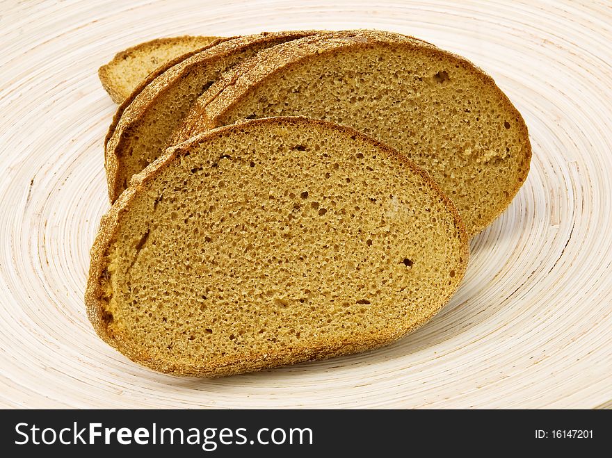 Rye bread on wooden plate