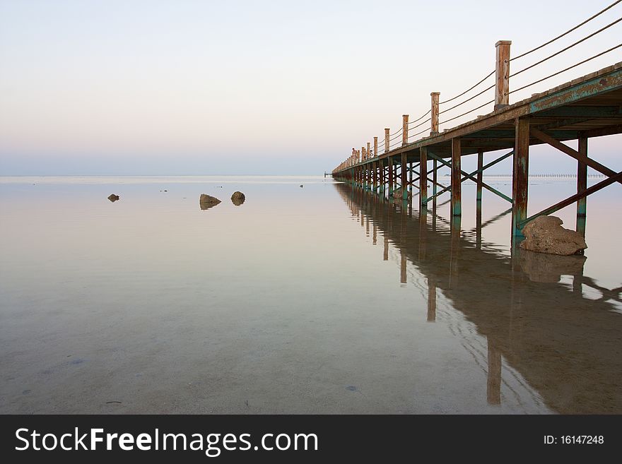 A jetty stretches out across the ocean in egypt. A jetty stretches out across the ocean in egypt