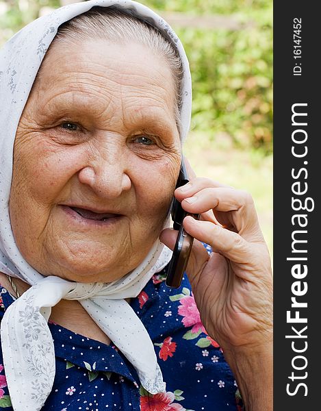 Grandmother Talking With A Phone