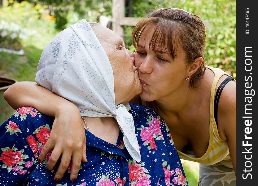 Grandmother and granddaughter embraced and happy outdoor