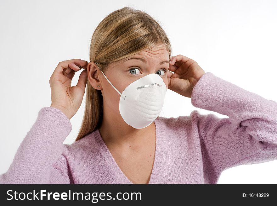 Young woman with protecting mask, white background