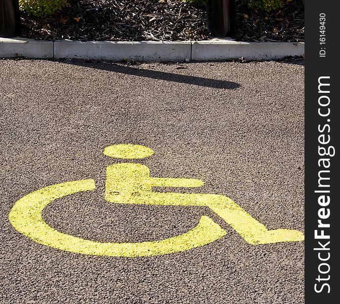 Yellow painted disabled parking bay