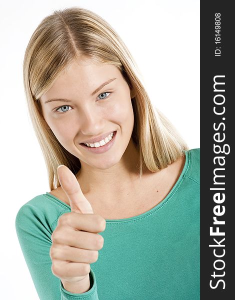 Beautiful teenage girl with thumbs-up, isolated on white