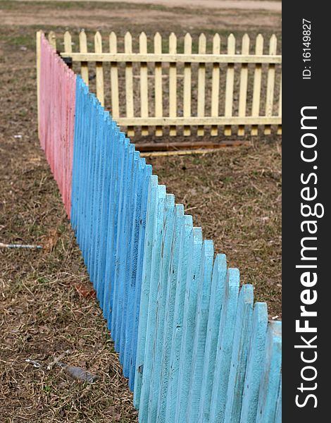 Wooden fence of different colors