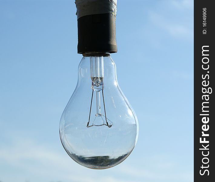 Electric lamp on a background of blue sky