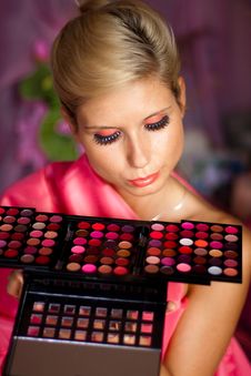 Beautiful Girl With Set Of Lipsticks For Make-up Royalty Free Stock Photography