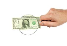 Dollar Bill And Hand Holding Magnifying Glass Stock Photos