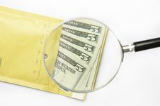 Dollars In The Envelope With Magnifying Glass Stock Images