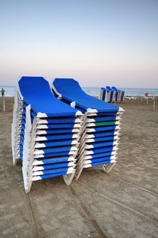 Stacked Blue Deckchairs On A Beach Stock Photography Stacked Blue Deckchairs On A Beach Stock Photography