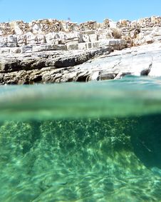 Stone Wall On A Rocky Beach, Sea Split Royalty Free Stock Photo Stone Wall On A Rocky Beach, Sea Split Royalty Free Stock Photo