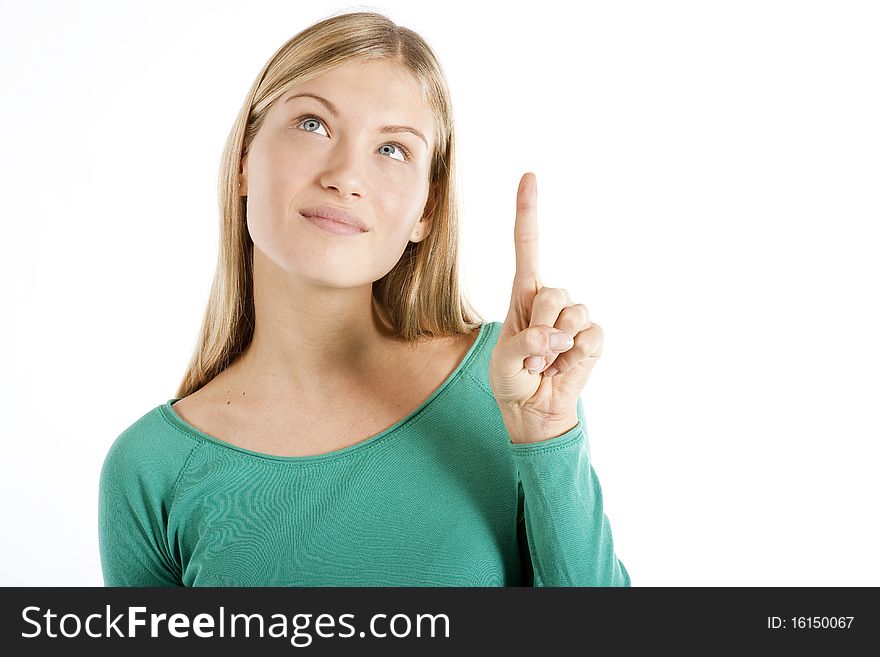 Young woman pointing at something, isolated on white