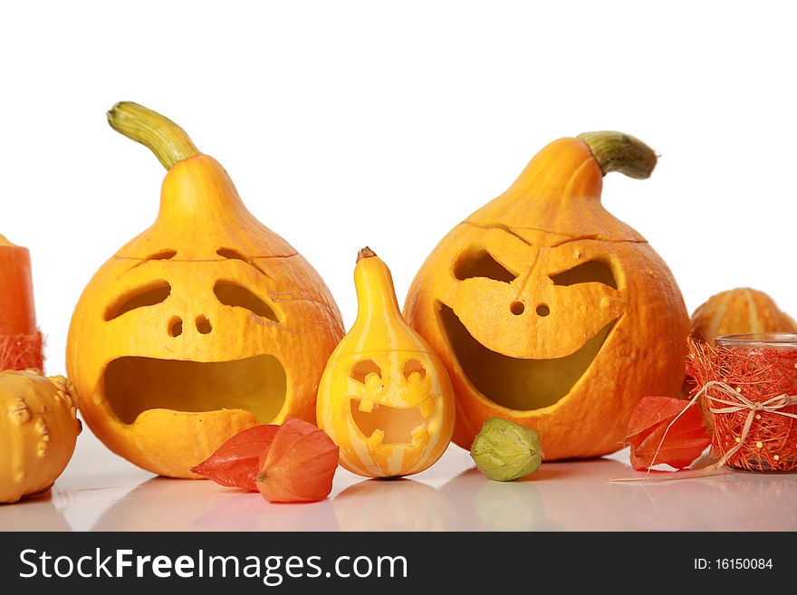 Halloween pumpkins with funny faces on white. Halloween pumpkins with funny faces on white