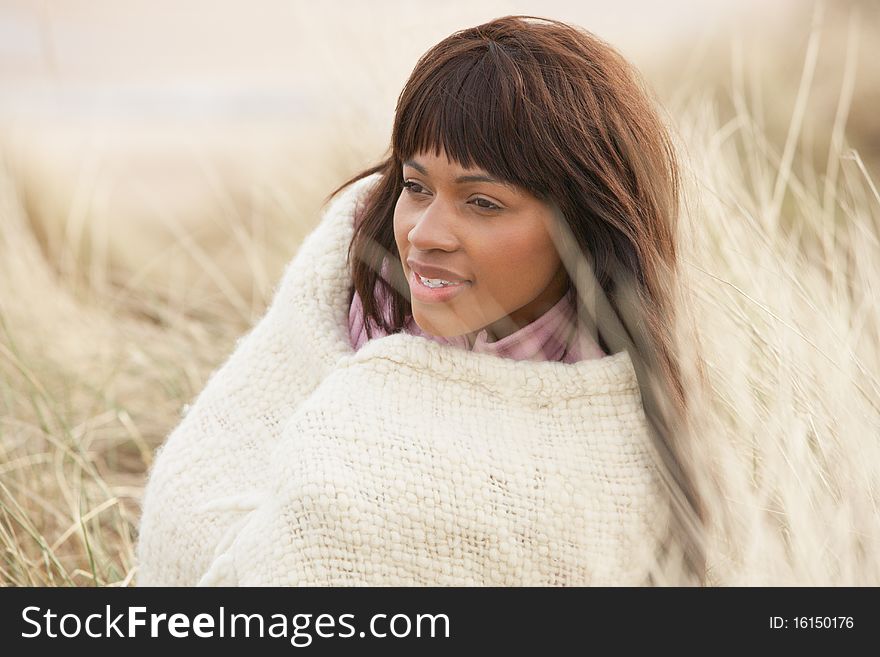 Woman Wrapped In Blanket Amongst Dunes On Winter B