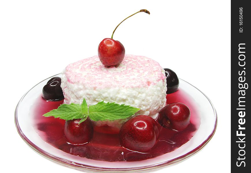 Curd dessert with cherry jam decorated by mint. Curd dessert with cherry jam decorated by mint