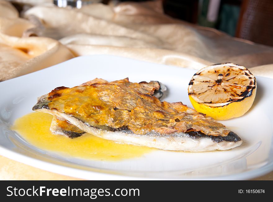 Grilled fish with lemon and chili sauce. Grilled fish with lemon and chili sauce