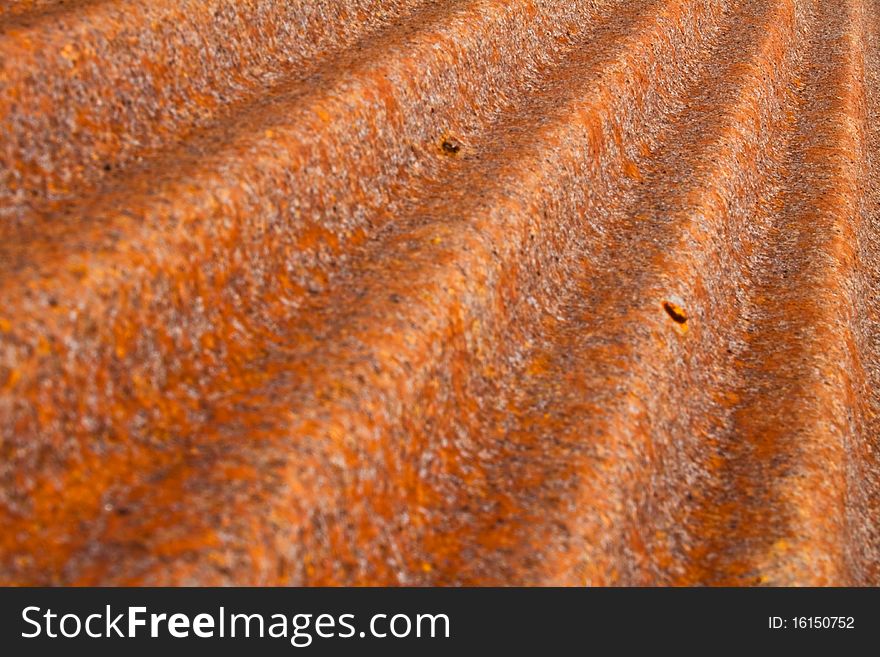 A rusty corrugated iron metal fence Zinc wall