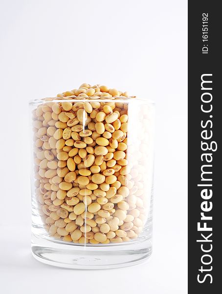 Soybean in a glass on white background