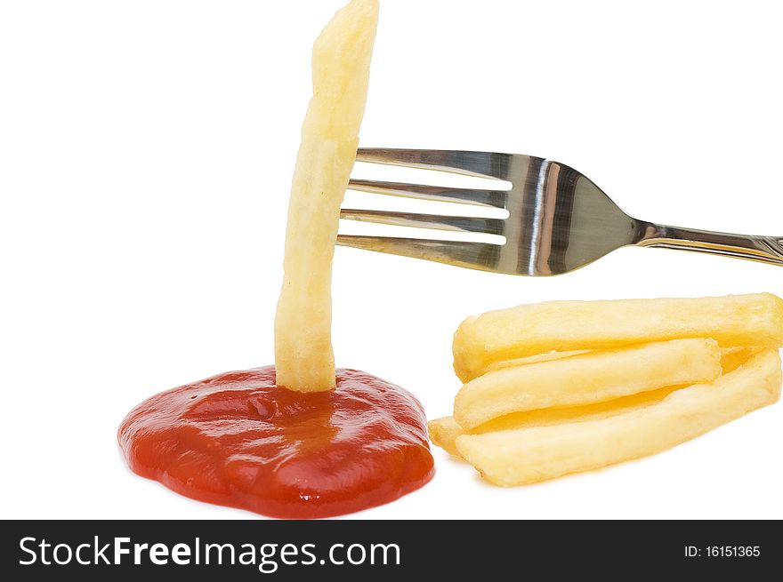 Fried chipped potato on a fork isolated over white. Fried chipped potato on a fork isolated over white