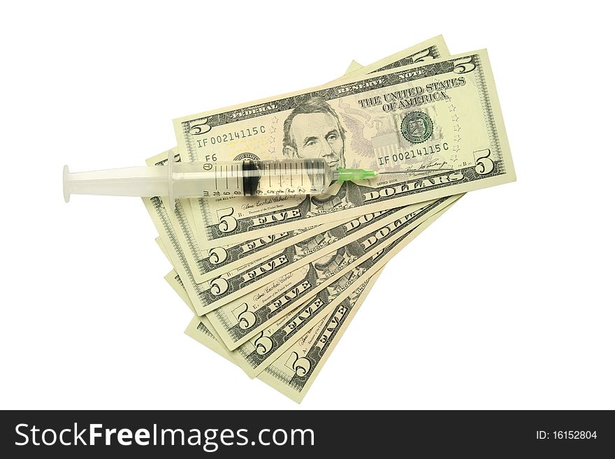 Five dollar bills and syringe isolated on white background