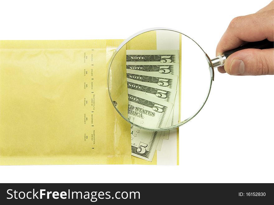 Dollars in the envelope and hand holding magnifying glass isolated on white background