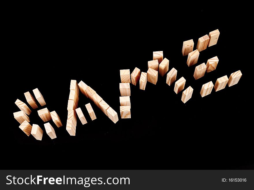 Game Spelled Out With Wooden Blocks