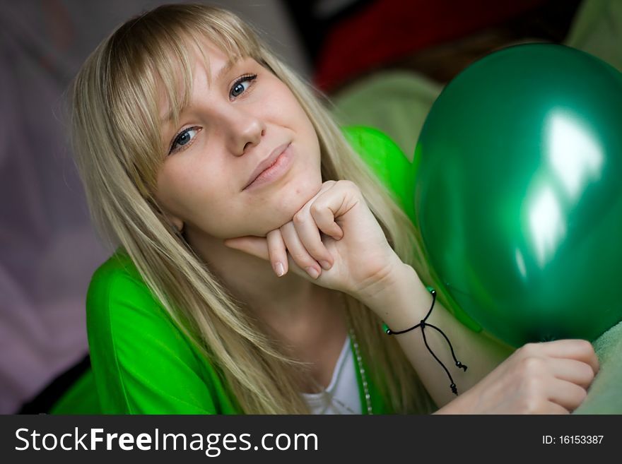 Happy beautiful girl with green balloon. Happy beautiful girl with green balloon