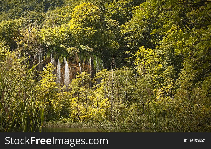 Autumn Landscape With A Waterfall