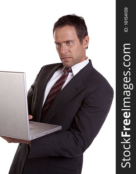A man is concentrating on his laptop. A man is concentrating on his laptop.