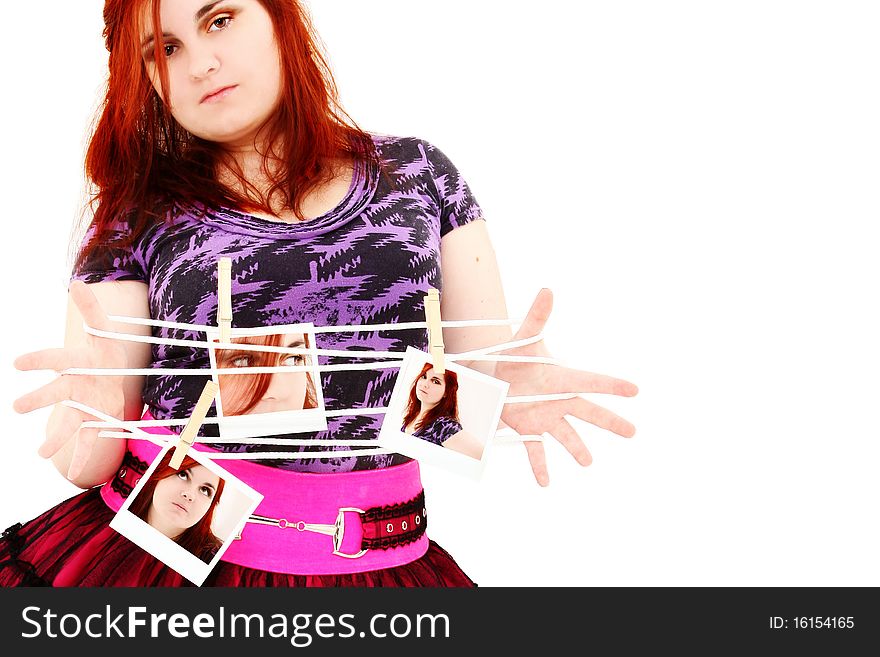 Beautiful 19 year old girl standing with Polaroid photos of self over white background. Beautiful 19 year old girl standing with Polaroid photos of self over white background.