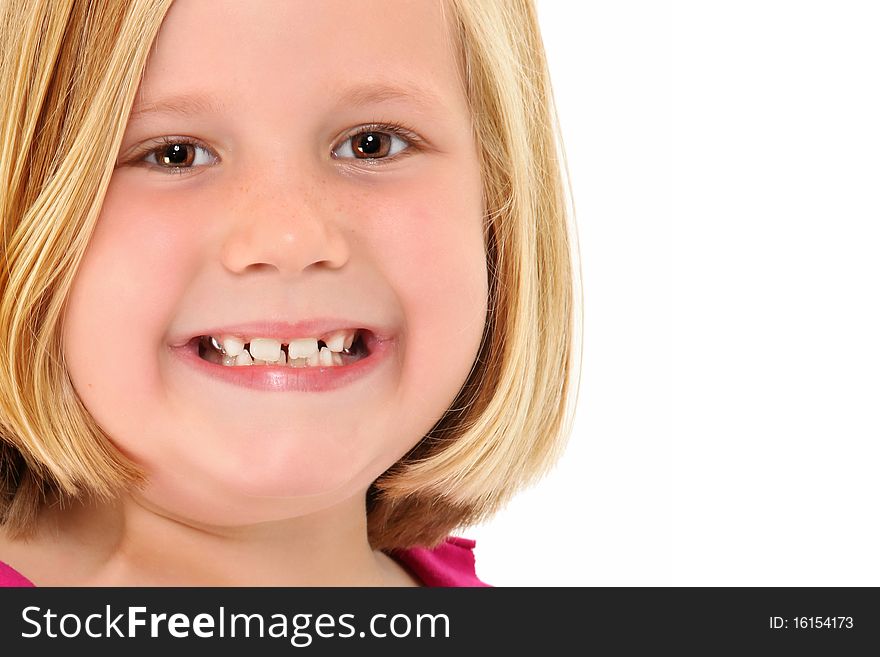 Adorable 7 year old blond american girl close up head shot over white background smiling. Adorable 7 year old blond american girl close up head shot over white background smiling.