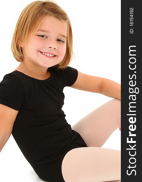 Adorable 5 year old american girl in dance uniform over white background. Adorable 5 year old american girl in dance uniform over white background.