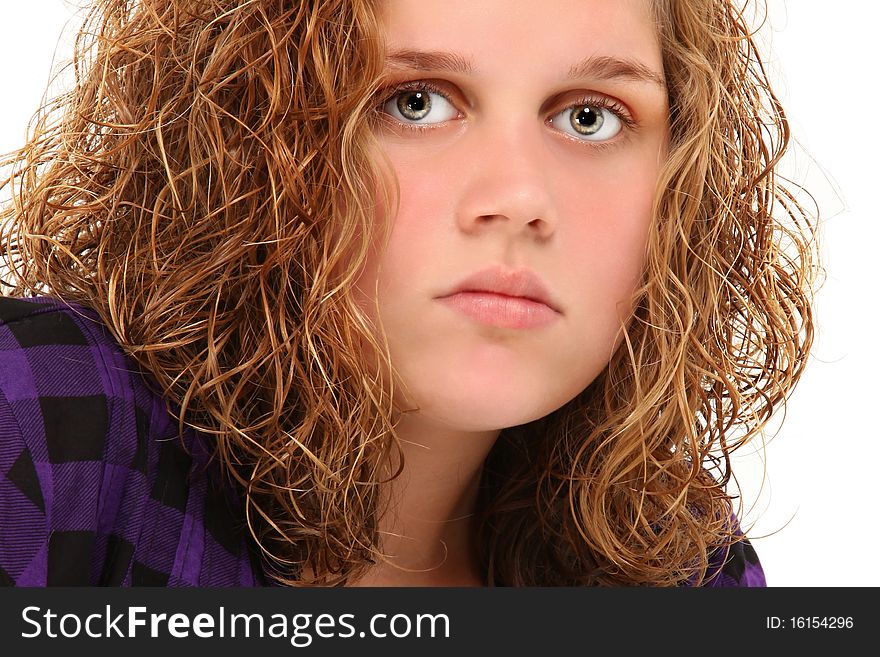 Close up 13 year old teenager with curly blond hair. Close up 13 year old teenager with curly blond hair.