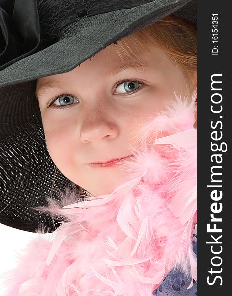 Beautiful five year old american girl in mom's dress and hat with pink feather boa over white. Beautiful five year old american girl in mom's dress and hat with pink feather boa over white.