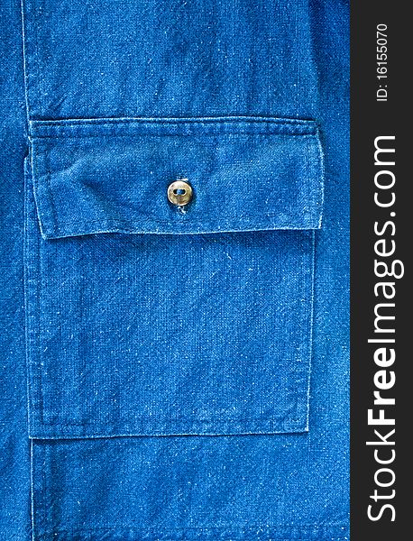 Blue pocket denim jacket fragment closeup shot