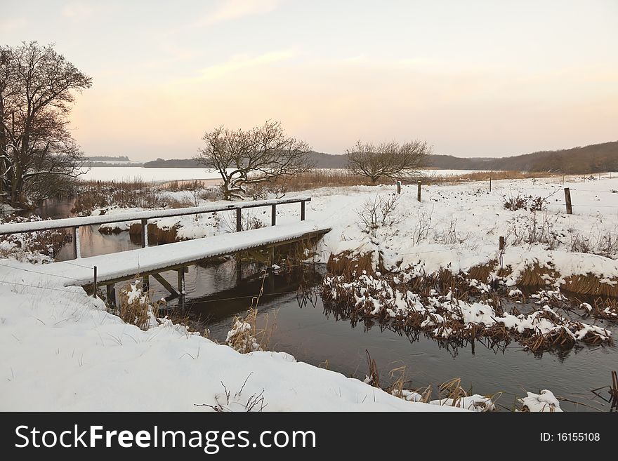 Bridge over the river in winter time. Bridge over the river in winter time.