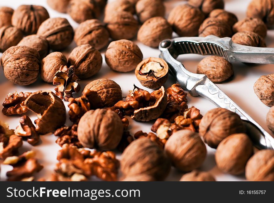 Nutcracker with walnut on a white background. Nutcracker with walnut on a white background