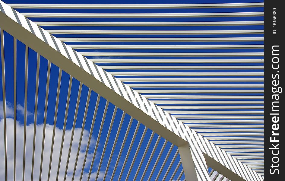 White lines and angles in front of the Sky (roof in a public park in Spain)