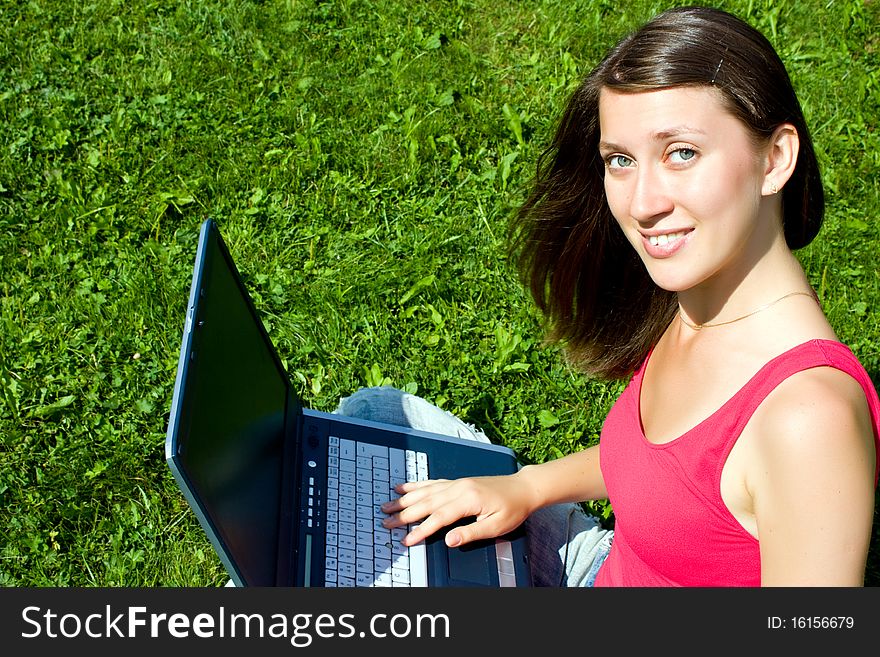 The Girl With Laptop On The Nature