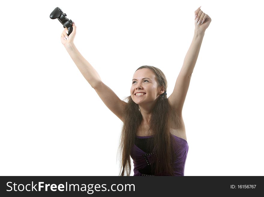 Young women play wideogame by gamepad on the white isolated background. Young women play wideogame by gamepad on the white isolated background