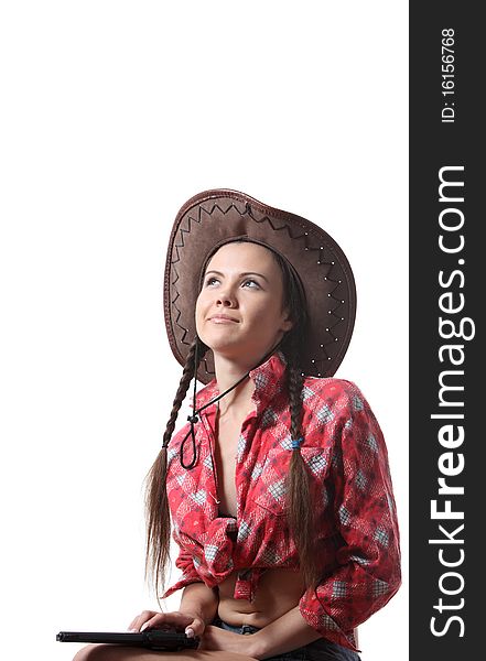 Pretty young girl in the cowboy hat with two pigtails. Pretty young girl in the cowboy hat with two pigtails