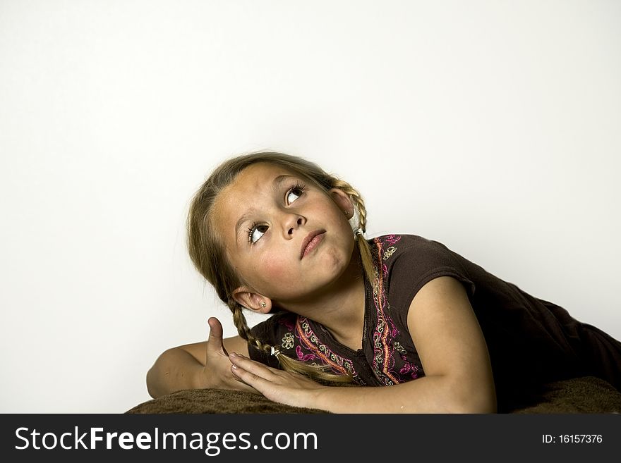 Beautiful young girl looking up over her shoulder