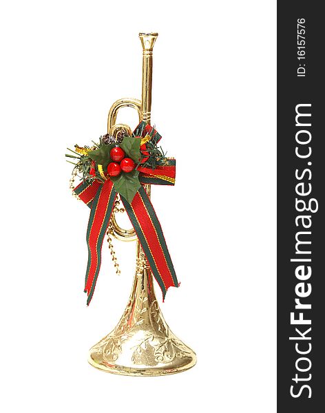 An isolated shot of a Christmas trumpet decoration.